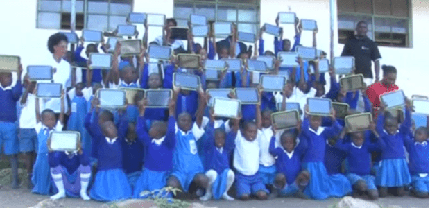 Pupils from Homa Bay Primary school holding up their Digital