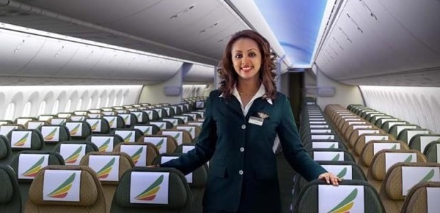 A flight attendant in the 787′s economy class. (Image from
