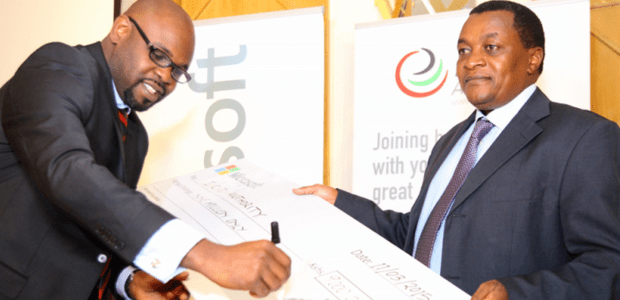 Signing the dummy sponsorship cheque is Kunle Awosika, Country Manager,