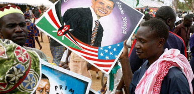 Supporter in Kenya holding up Obama's portrait