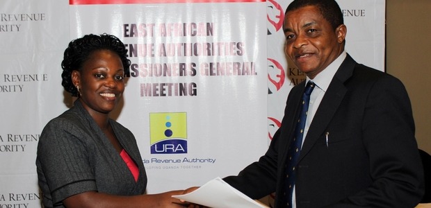 Uganda Revenue Authority, Commissioner, Legal Services, Patience Rubagumya, exchanges memorandum