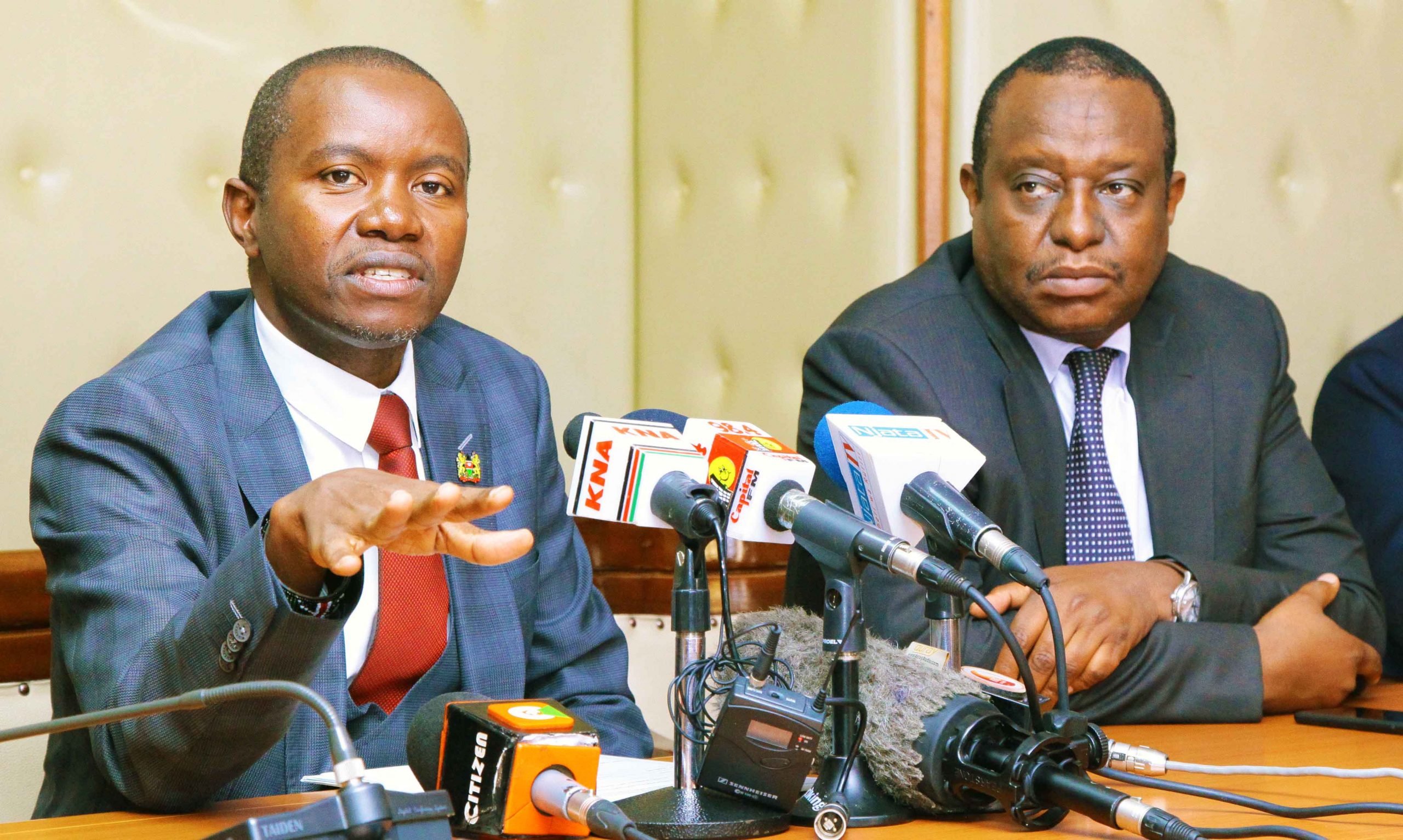 The CS Ministry of ICT Joe Mucheru addressing the press during a press conference at the MICT offices. With him is the CS Ministry of Treasury Henry Rotich.