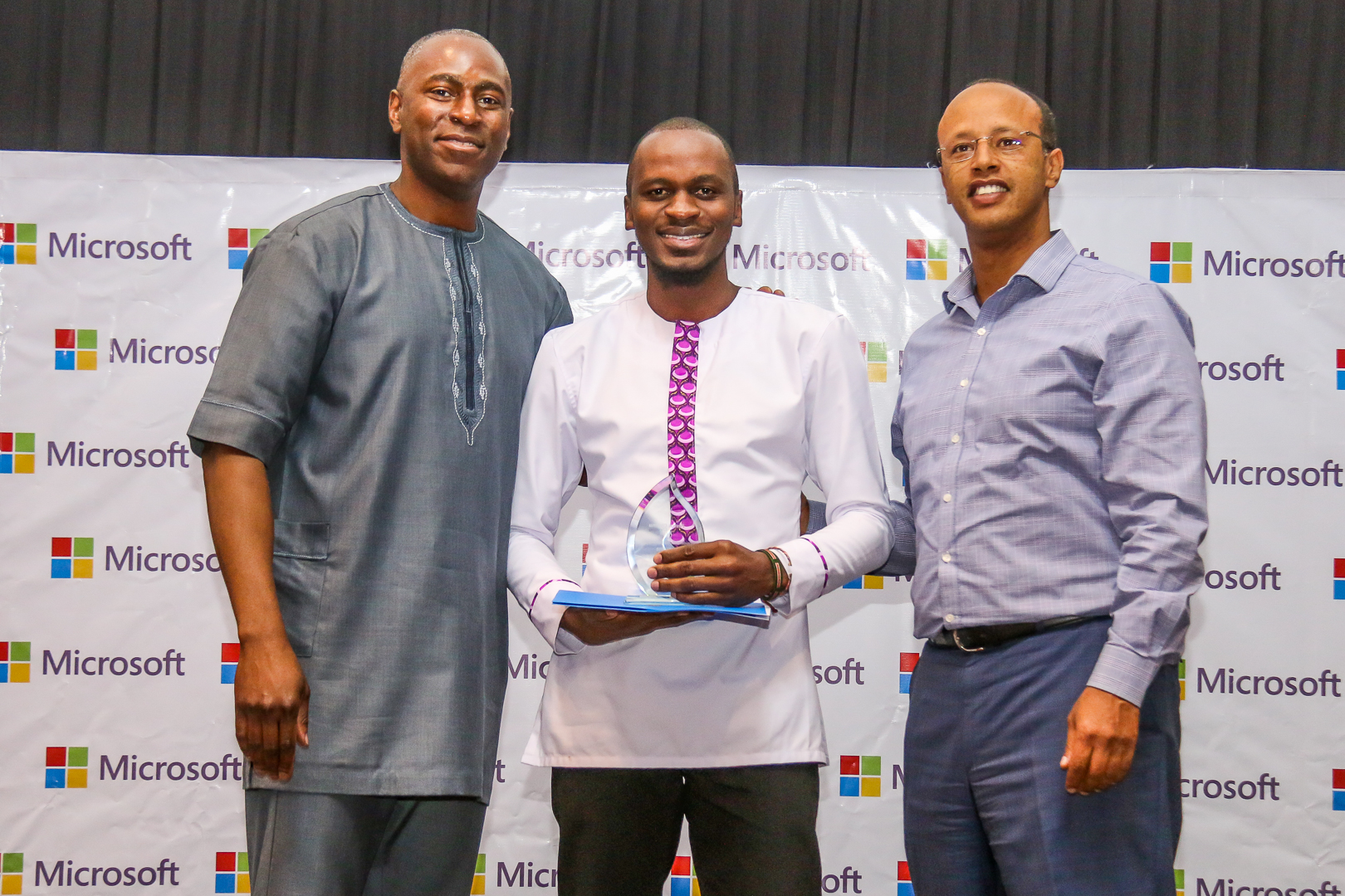 L-R Director of Software Engineering at Microsoft, Bambo Sofola, Insiders4Good graduate, Festus Okumu Sebuh Haileleul - General Manager, Microsoft East Africa during the graduation.