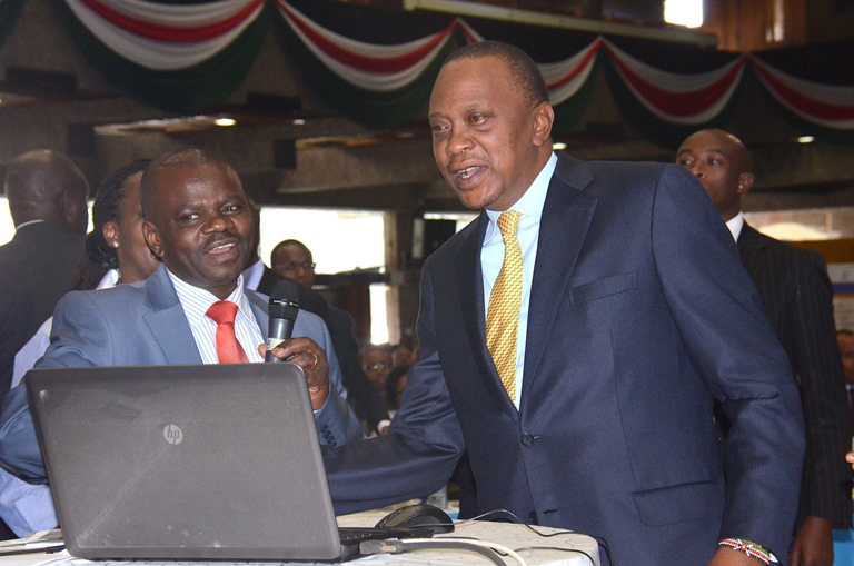 Jerome Ochieng alongside President Kenyatta during the launch of IFMIS