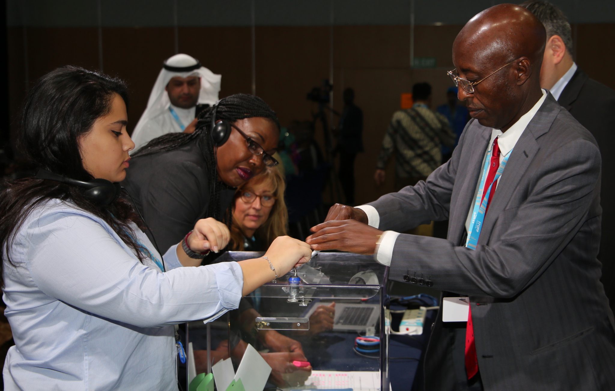Communications Authority of Kenya (CA) chairman Mr.Ngene Gituku (right) casts his ballot during elections for membership to the International Telecommunications Union (ITU) Council today in Dubai, United Arab Emirates. Kenya was re-elected to the Council with 140 votes and joins 12 other countries that will represent Africa on the council.