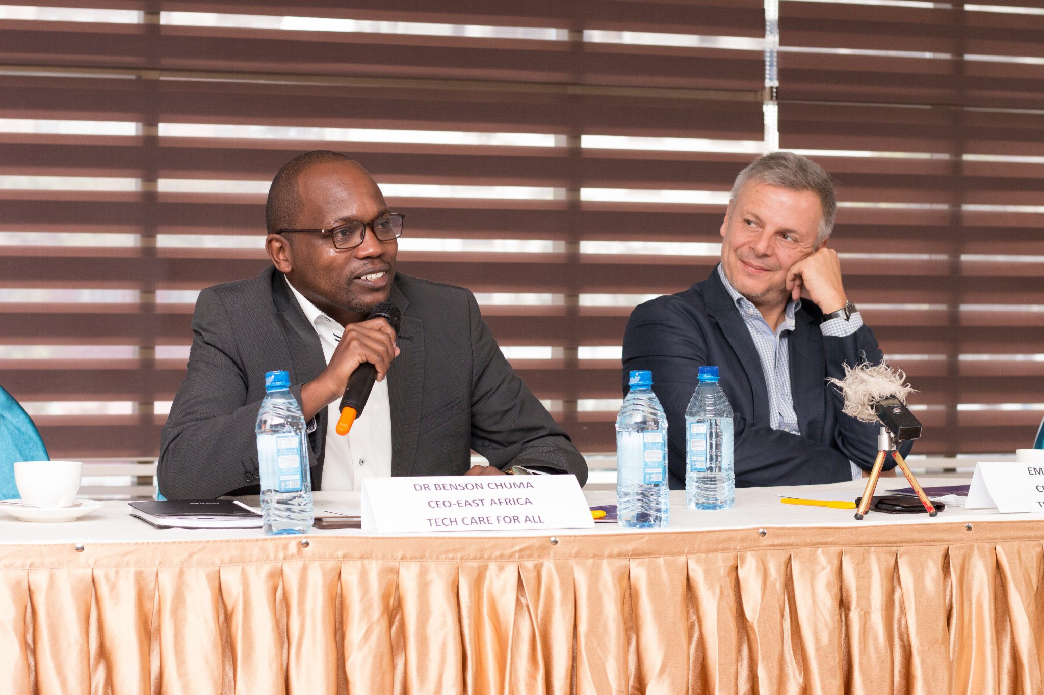 TC4A, CEO Dr. Benson Chuma (L) talks during the Kenyan