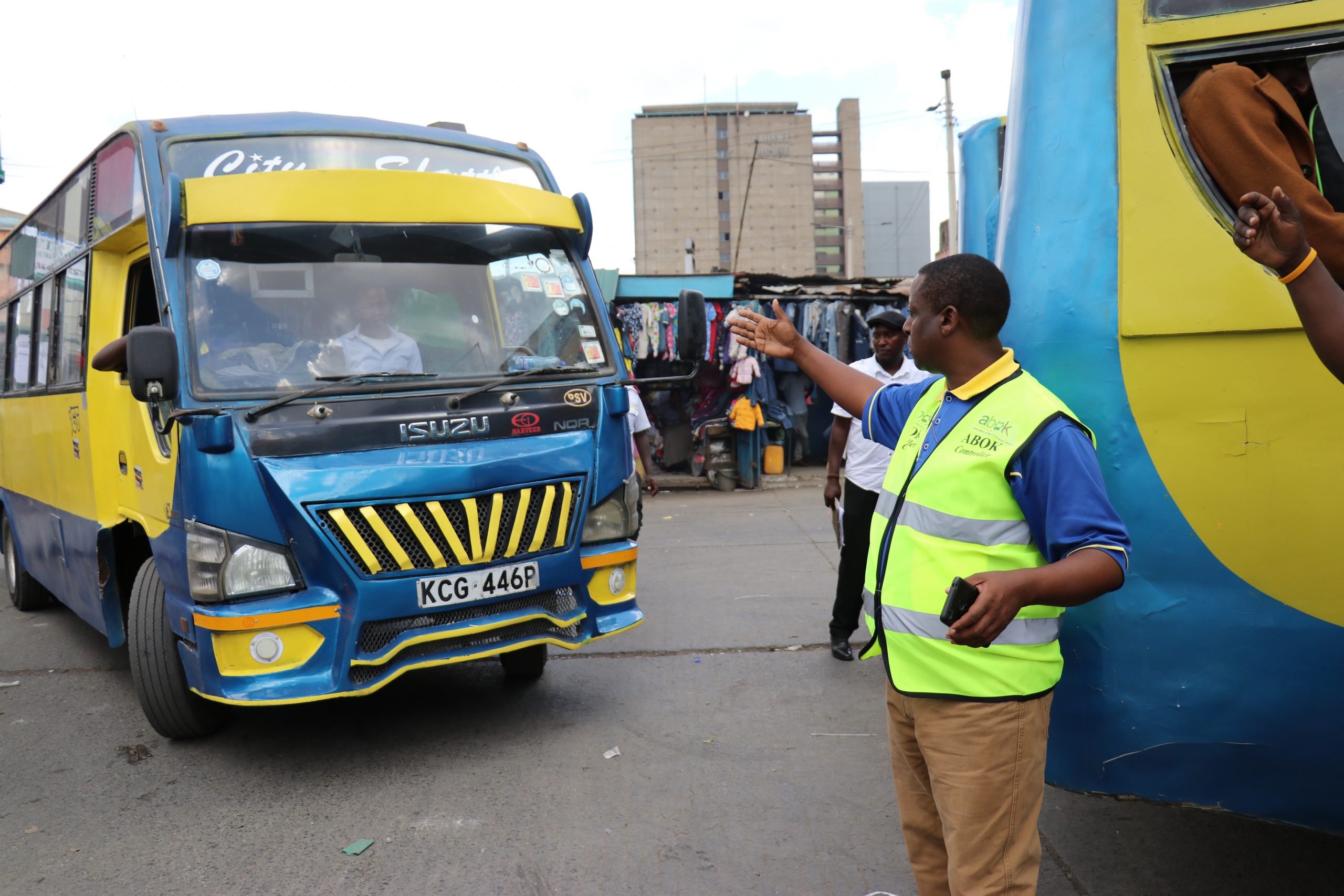 A traffic officer directs public matatus to ease congestion