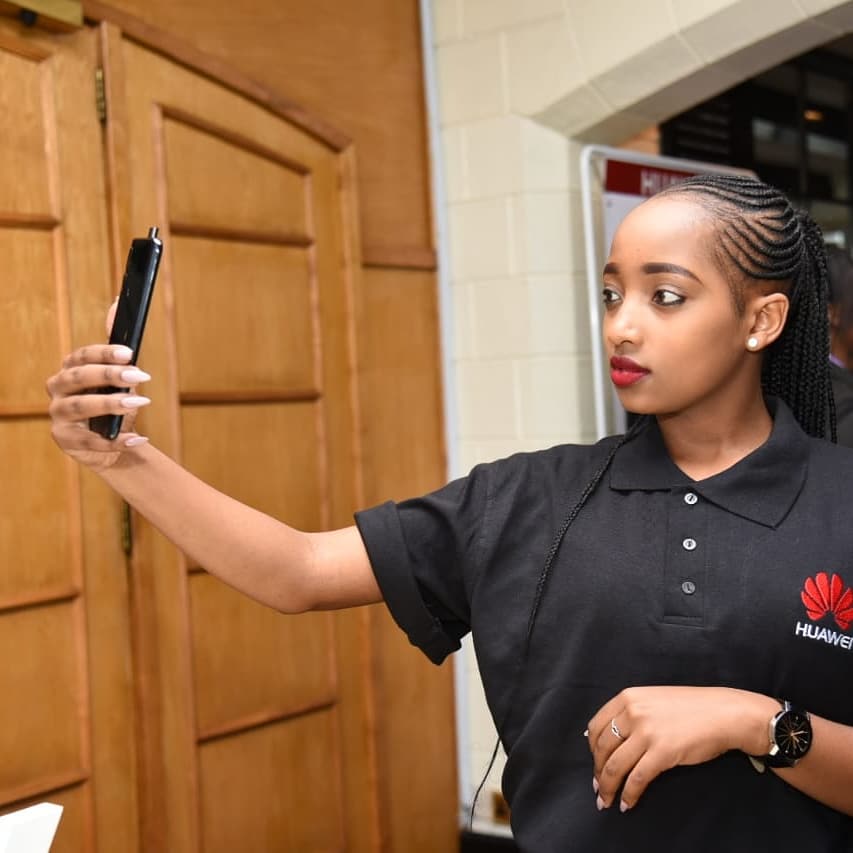 Huawei employee takes selfie with the recently launched Huawei Y9