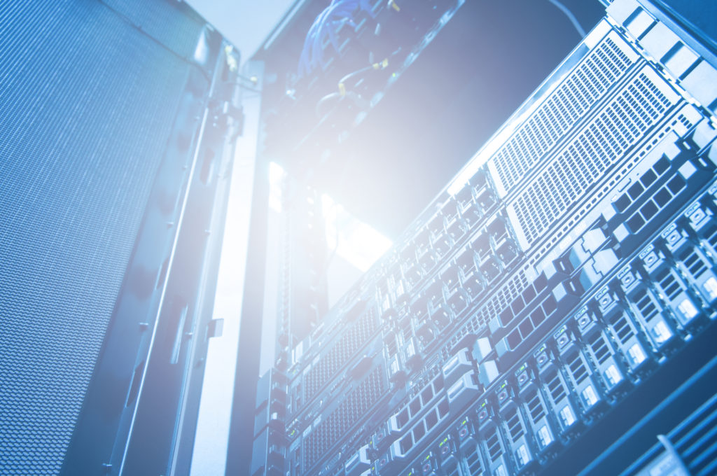 Bottom view of rack server storage and network against neon light in data center with dept of field in blue cool tone , technology background