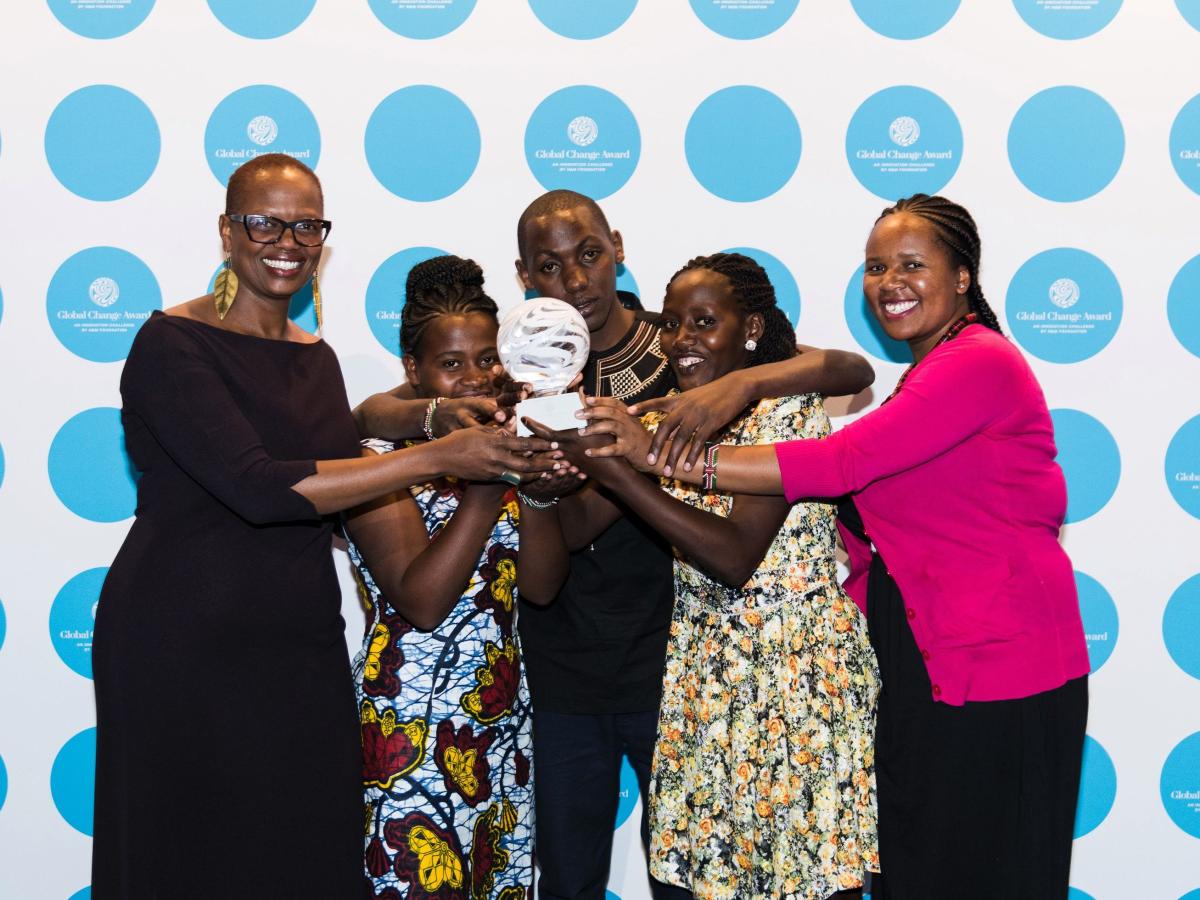The Green-Nettle Textiles team holds the Global Change Award they