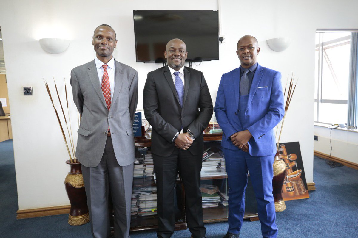 Joel Karubiu the new CIO KeNIC (center) poses for a