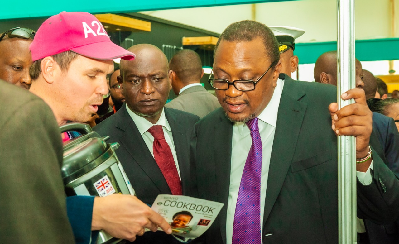 President Uhuru Kenyatta is taken through the off-grid solar products