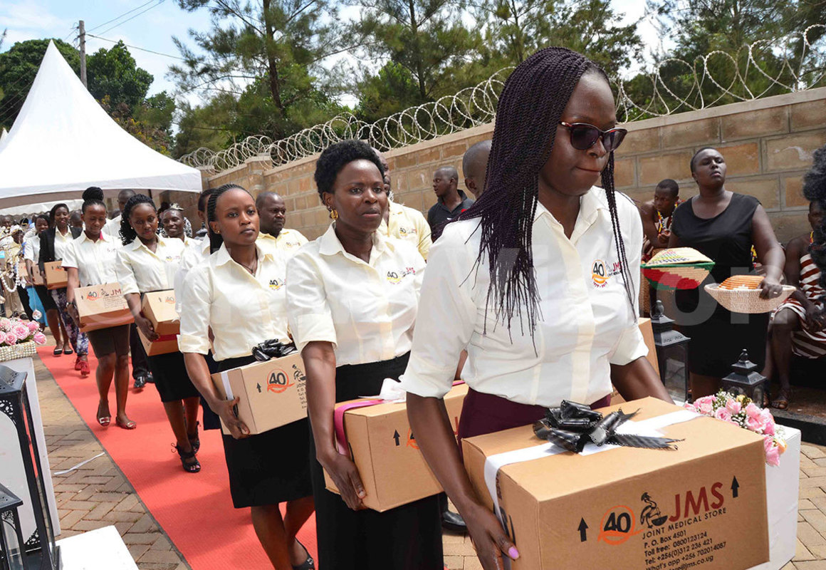 Employees of Joint Medical Store carrying medicines and other health