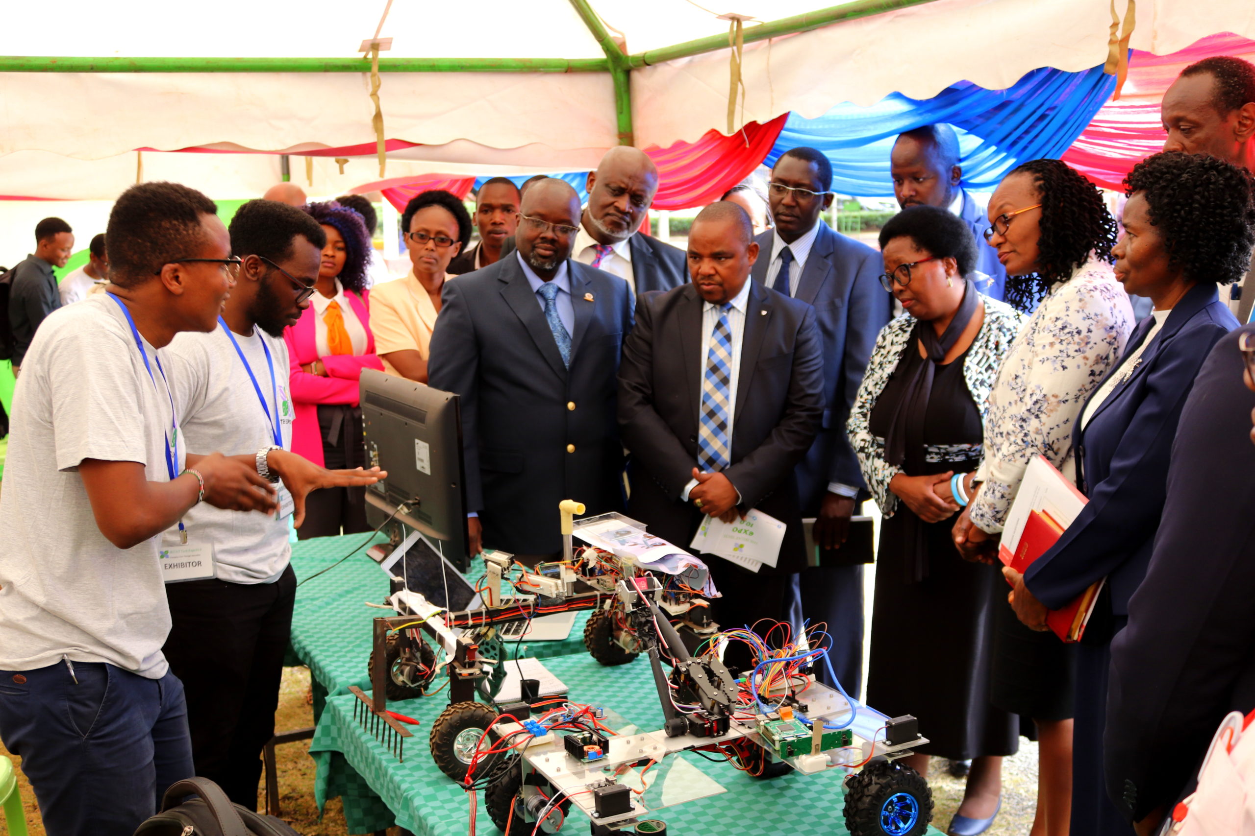 Micheal and Ken explain to the JKUAT Tech Expo guest