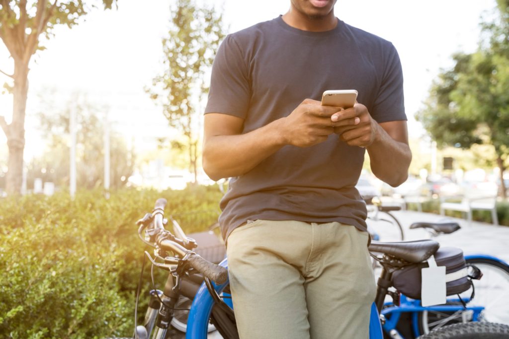 man-holding-smartphone-1024x683