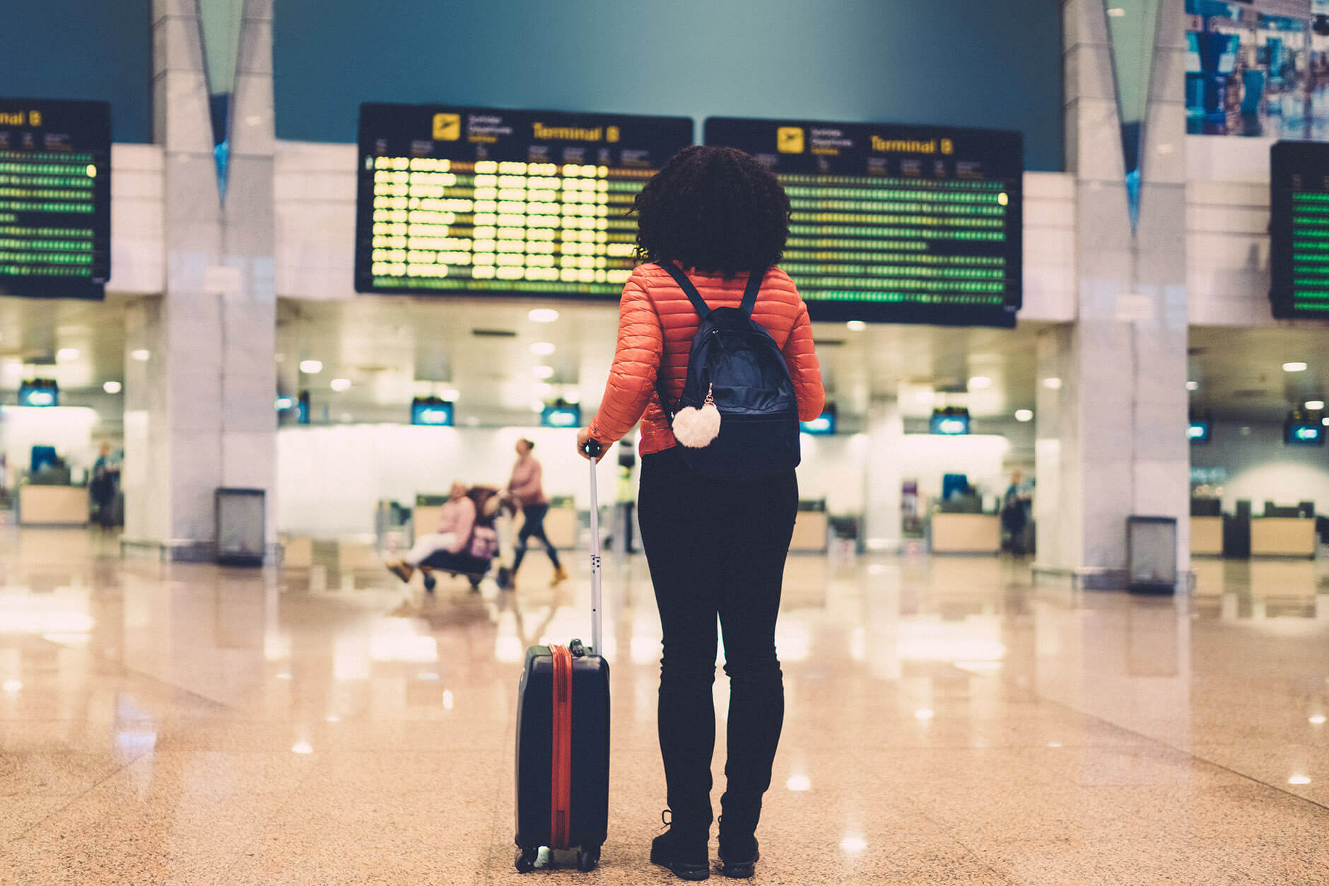 woman-standging-in-airport-travel-iSTock (1)