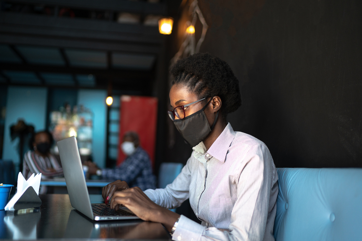 Woman Wears Protective Face Mask While Using Laptop In Shared Space By Fg Trade Gettyimages 1254986227 2400x1600 100858486 Large