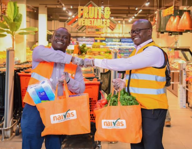Willy Kimani, Chief Commercial Officer, Naivas (left) with Kenneth Oyolla,