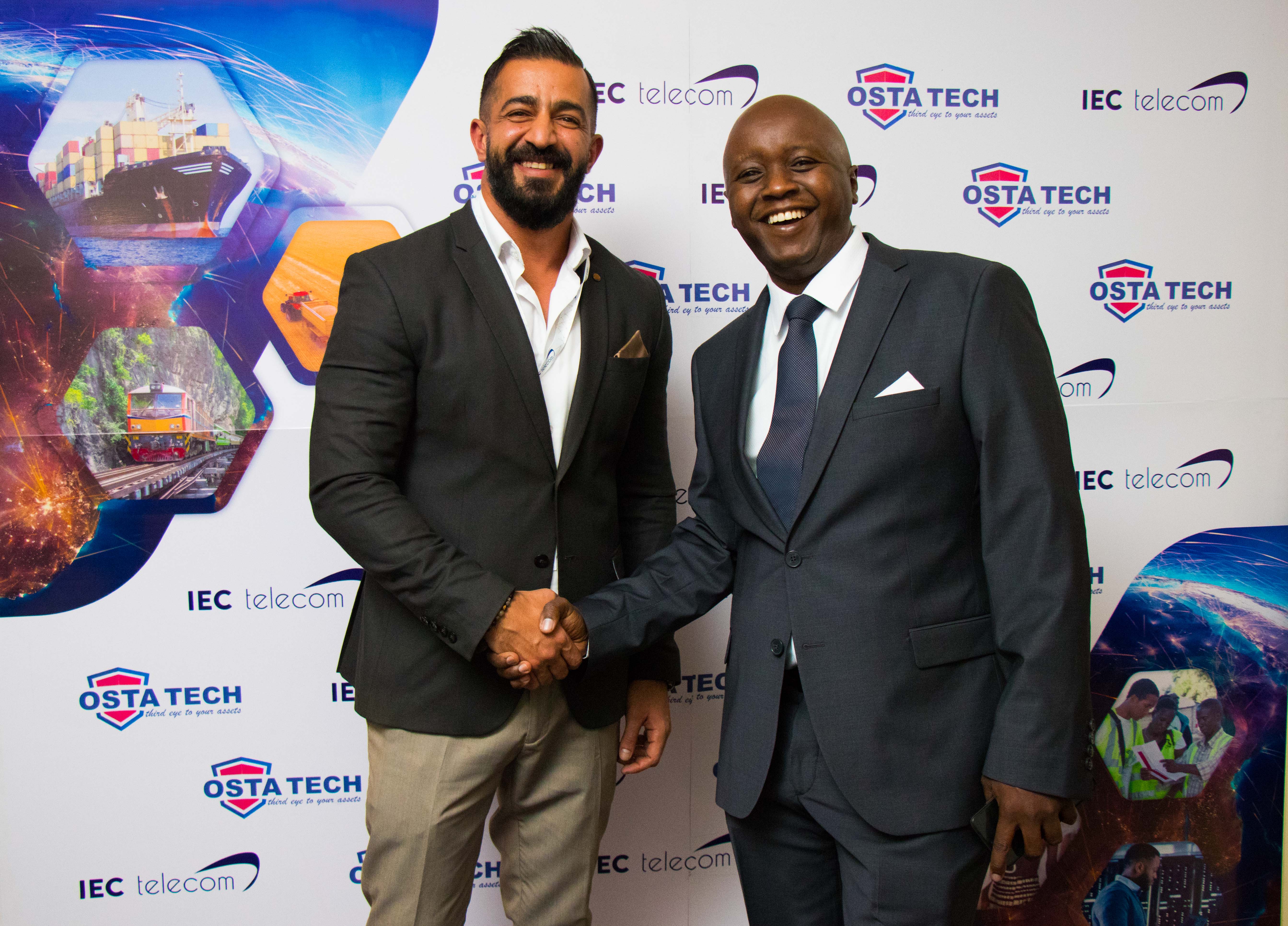 Ostatech Limited CEO, Oscar Mwai (right) with IEC Telecom Group