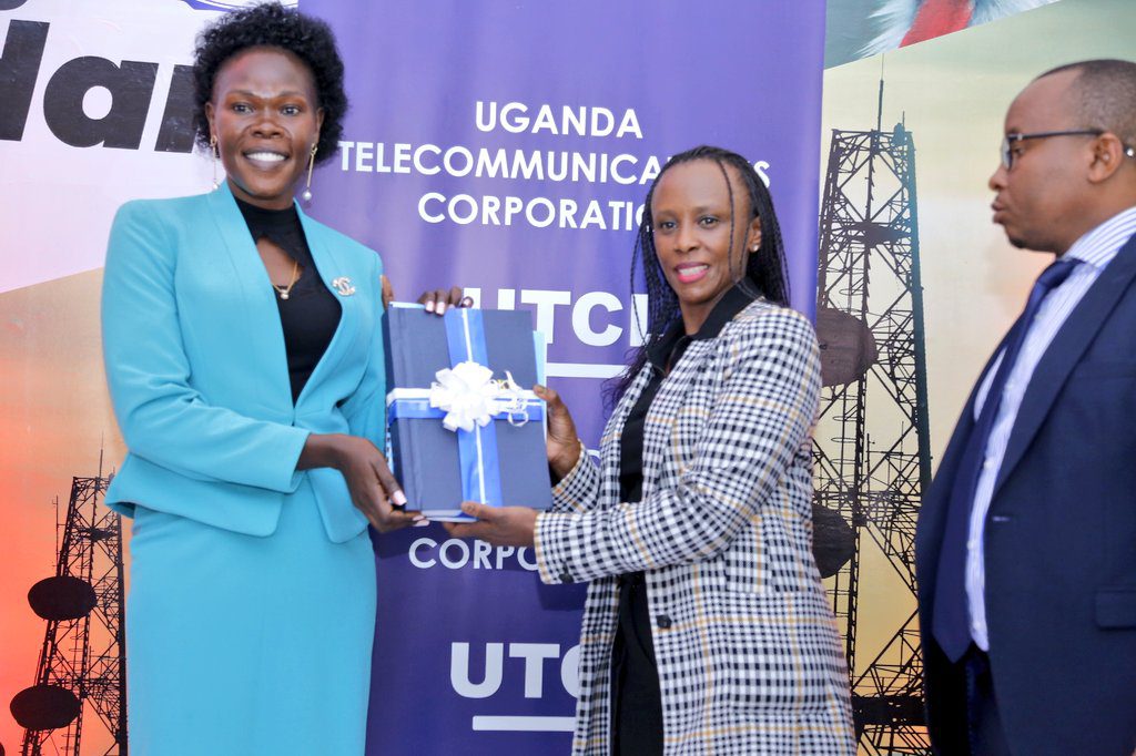 Minister of State for Privatization, Evelyn Anite (Left) handing over UTL to UTCL on Saturday