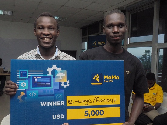 Ronald Akuayo (R) and Ivan Kisa emerged winners of the 2022 MTN momoHackathon at MTN Uganda Head Office in Kampala