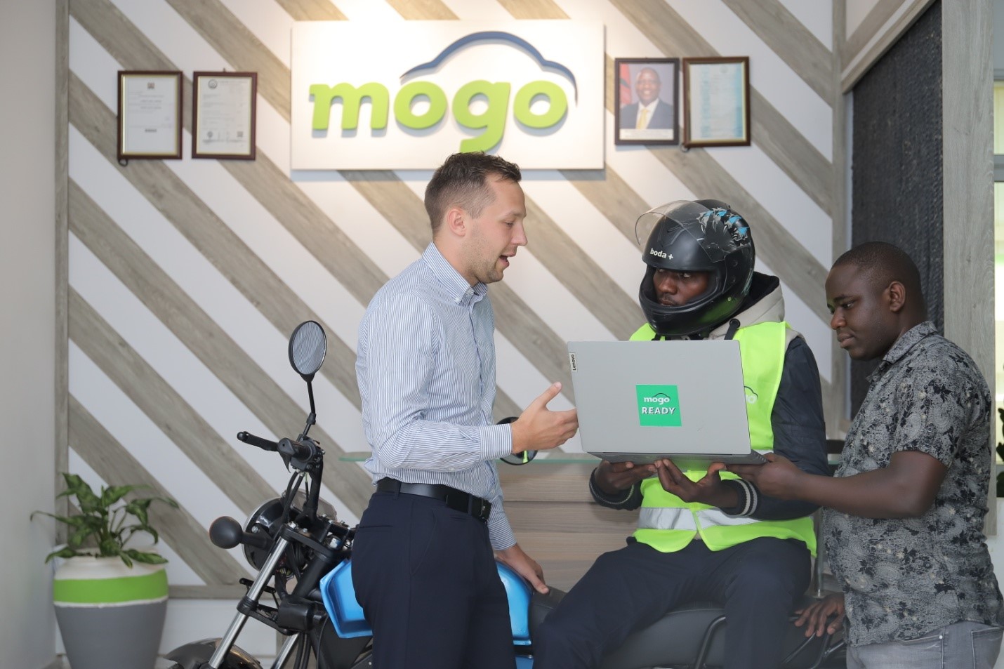 From Left: MOGO Kenya country manager Domas Mineikis, Boda Boda operator Elijah Kambati and MOGO’s head of underwriting Chris Murimi during the launch of the financial literacy tool. The tool is meant to give consumers a complete real time overview of their financial lives and wellness through a single digital platform.