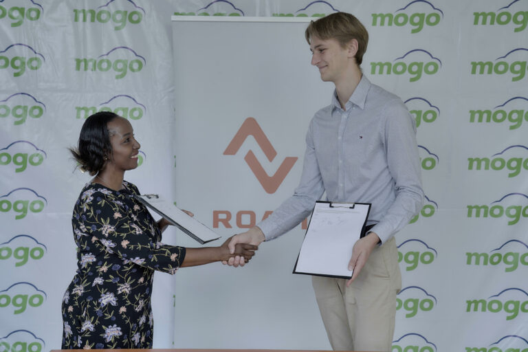 Mogo Business Development Manager Rauls Leitis (right) and Roam Sales Operations Manager Dionne Getata during the MoU signing in Nairobi.