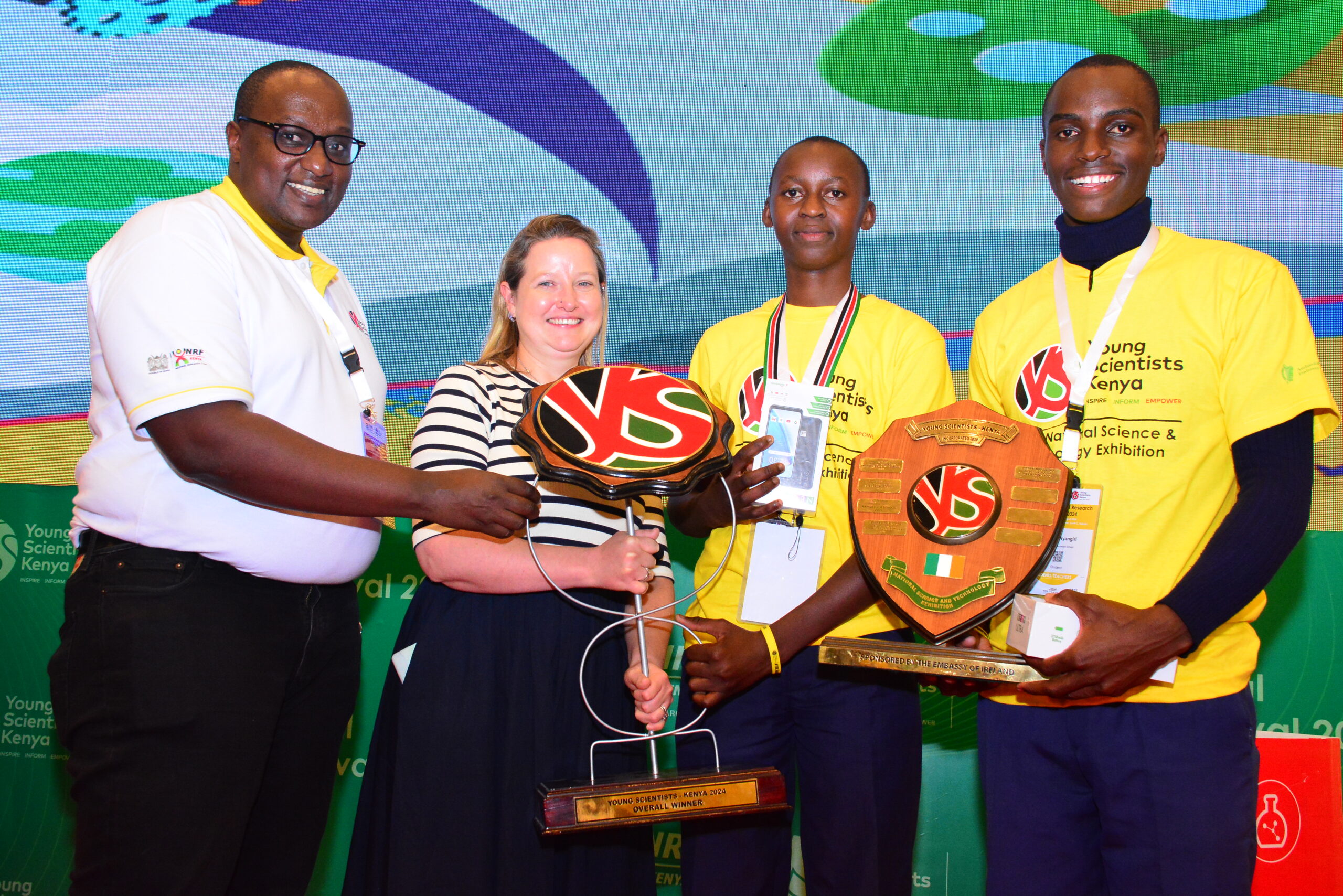 Dr. Eng. Victor Mwongera, Deputy Ambassador of Ireland Evelyn Maris awarding Menyenya School, the for being the overall winners of the 7th YSK awards