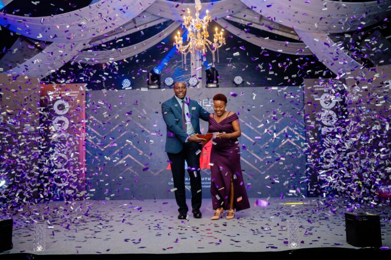 Deborah Mutungi receives her CIO Of The Year Award from her predecessor, Geoffrey Gitagia
