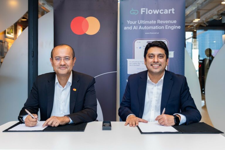 Shehryar Ali, senior vice president and country manager for East Africa and Indian Ocean Islands at Mastercard (left), and Saad Latif, Director of Commercial Operations at Flowcart, sign a strategic collaboration agreement to enable secure, seamless card payments within social and conversational commerce journeys across East Africa.
